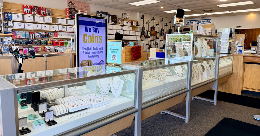 Clean, Bright, Organized Jewelry Display with Glimpses of Guitars & Game Systems in the Background