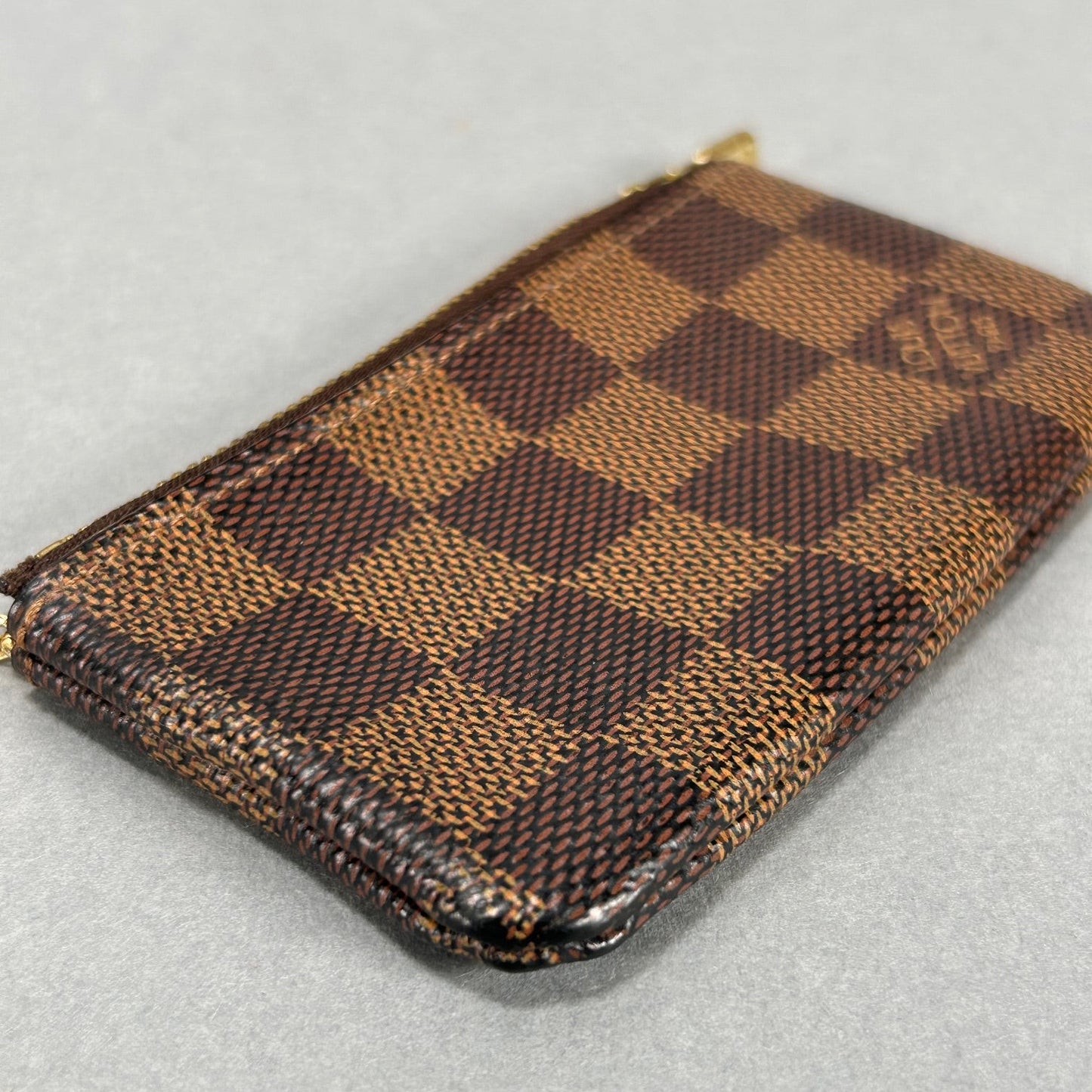 Louis Vuitton Damier Ebene Pochette Mini - Brown