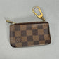 Louis Vuitton Damier Ebene Pochette Mini - Brown